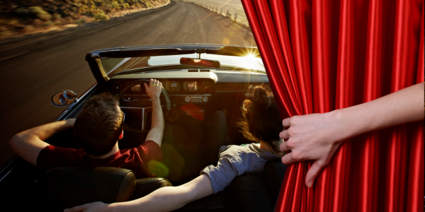 Image of a couple driving in a convertible on a scenic road for a blog on CA Driving and Traffic School Online Best Kept Secrets