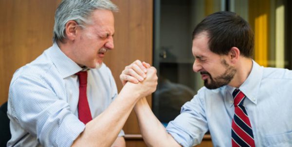 Image of two men arm wrestling for a blog on useful tips on how to fight a parking ticket in New York