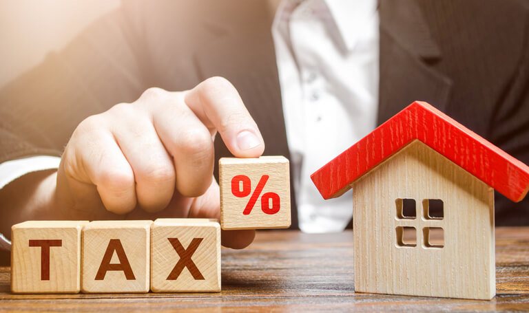 Man holds a percentage of new resident tax.