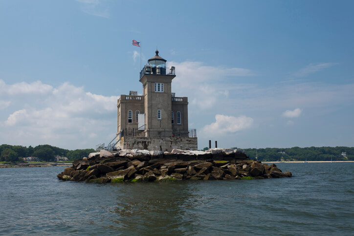 "Exterior view of Huntington Harbor Lighthouse, New York. Viewed from a boat."