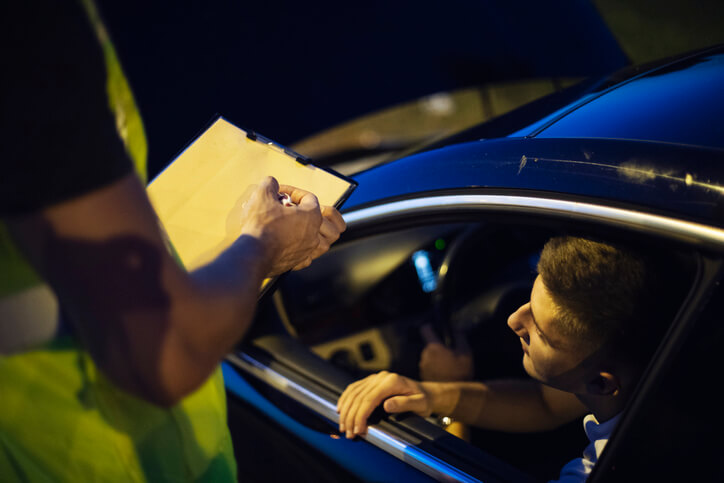 A driver receiving a red light violation ticket in Arizona