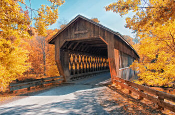 A beautiful road leads to a covered bridge in the great State of Ohio, a journey more confidently undertaken with knowledge of Ohio License Points.