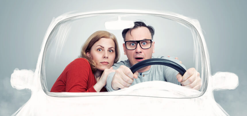 A playful image of a husband and wife driving a vehicle, distressed at the additional insurance premiums they may have to pay thanks to 3 key dangerous driving habits.