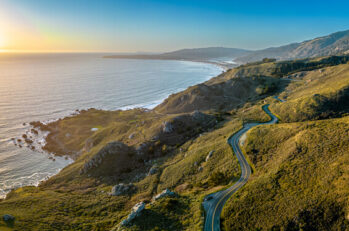 Pacific coast road Highway 1 California. Aerial shot at the pacific at sunset. Muir Wood. San Francisco Drone panorama scenic shot. Coastal Road Trip. USA America