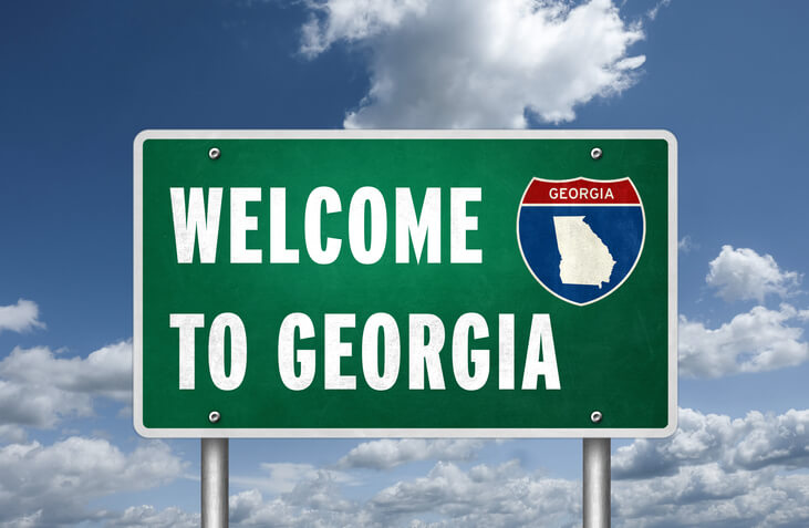 A "Welcome to Georgia" sign that does not mention the GA Department of Driver Services.