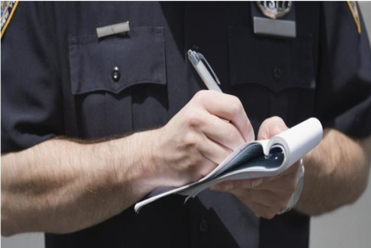 Police officer writing a ticket