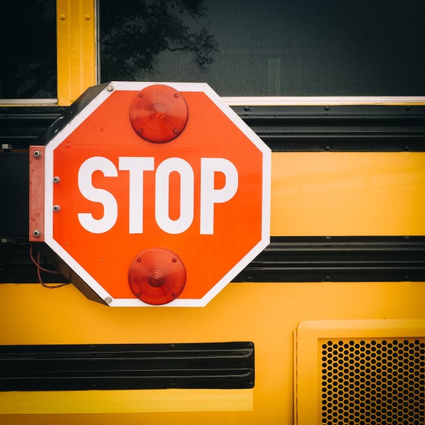 Child chasing a ball into the street where a car is approaching. Complete Traffic Safety For Kids