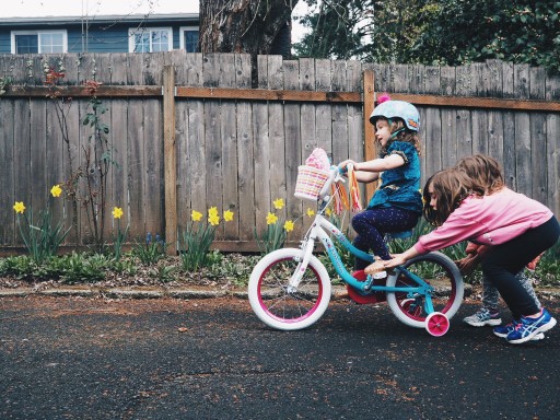Child chasing a ball into the street where a car is approaching. Complete Traffic Safety For Kids